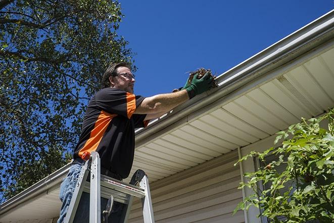 professional contractor fixing a damaged gutter in Berkeley Heights